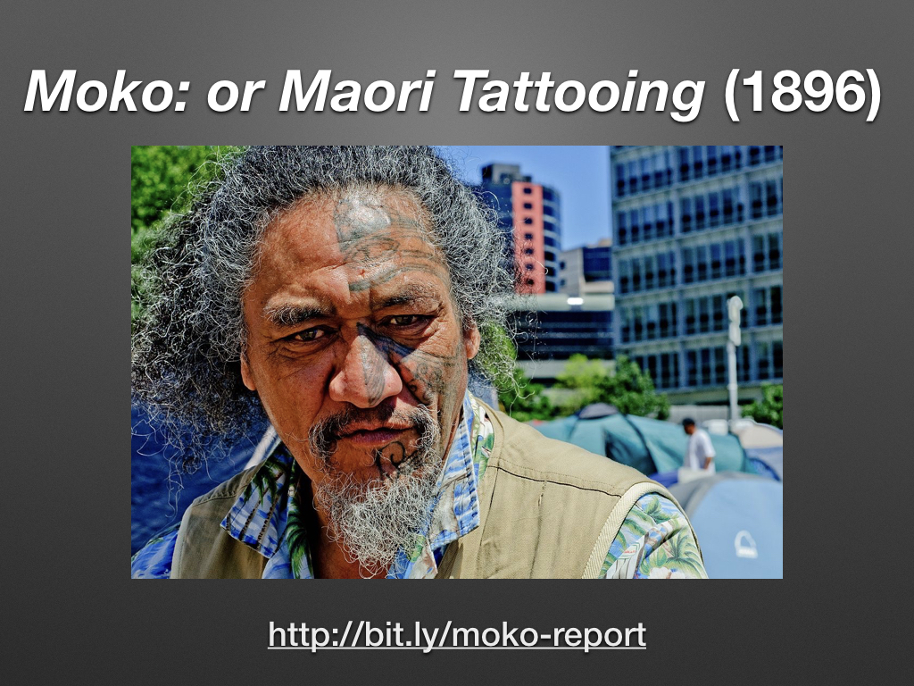 Maori man who has the right side of his face tattooed.